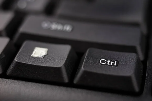 An enlarged computer keyboard. Black keyboard buttons for the co — Stock Photo, Image