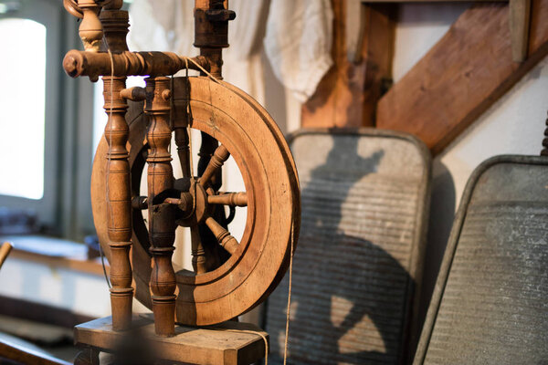 Spindle in an old room. Old home accessories for a housewife.