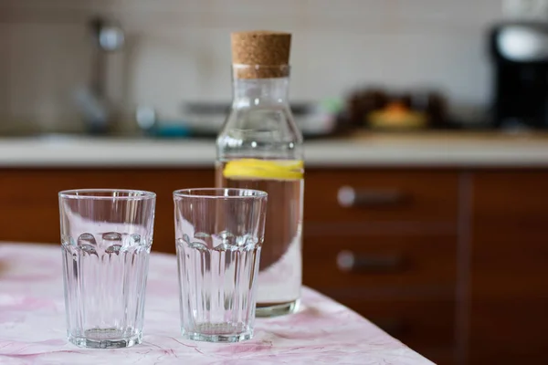 Fresh water with lemon. A refreshing drink in a glass container Stock Picture