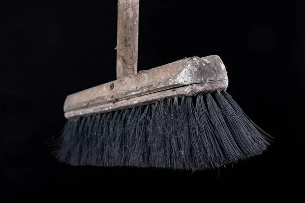 Old dusty wooden broom. Cleaning accessories. — Stock Photo, Image