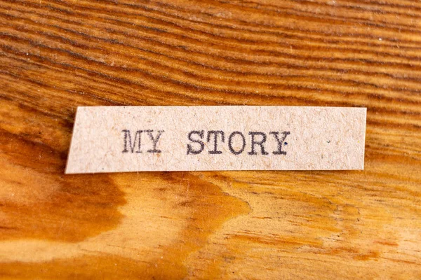 Napsali slovo "můj příběh". Nápis na šedém listu pa — Stock fotografie
