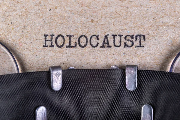 La palabra holocausto escrita en letra de máquina de escribir. La inscripción i —  Fotos de Stock