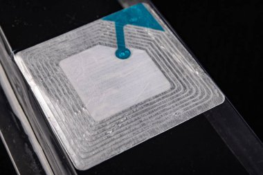 Sticky security chip to the packaging of the goods in the store.