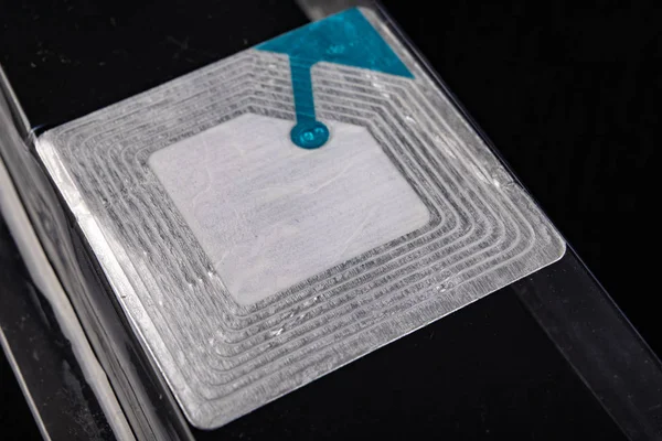 Sticky security chip to the packaging of the goods in the store.