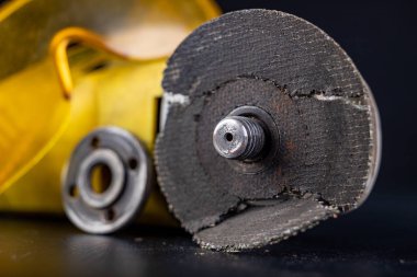 Damaged cutting disc for metal in an angle grinder. Power tools 