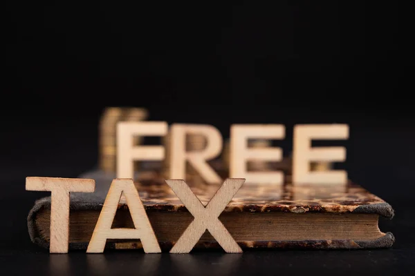 The word tax arranged from wooden letters on the background of t — 图库照片