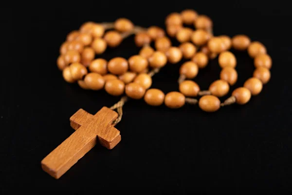 Wooden rosary arranged on the table. Prayer accessories. — Stock Photo, Image
