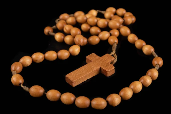 Wooden rosary arranged on the table. Prayer accessories. — Stock Photo, Image
