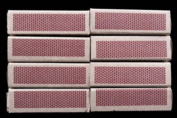 A place to set fire to the fire and resurrect a matchbox. Match boxes made of wide paper. Dark background — Stock Image Place Set Fire Fire Resurrect Matchbox Match Boxes Made Wide Stock Picture