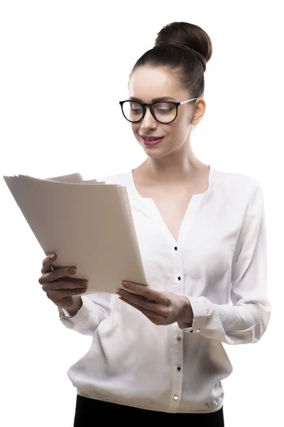 Office girl in glasses holds papers in hands isolated on white Stock Picture