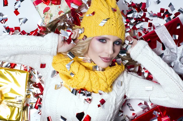 Beautiful blonde the girl in a yellow hat and a scarf — Stock Photo, Image