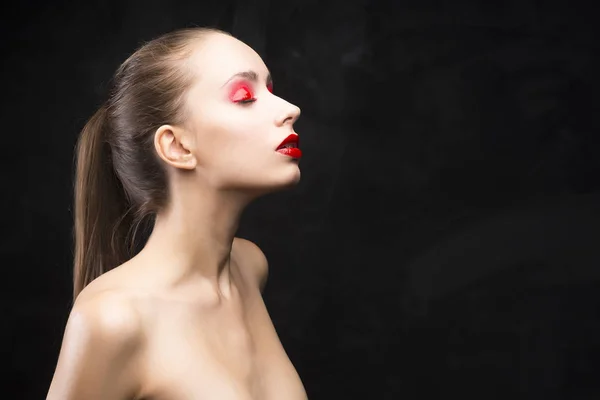 Girl with the red eyeshadow covered with gloss — Stock Photo, Image