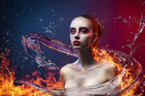 Beautiful girl surrounded with the dragon made of water and fire — Stock Photo, Image