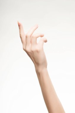 güzel kadın eli hafif pembe manikür üzerinde çivi ile
