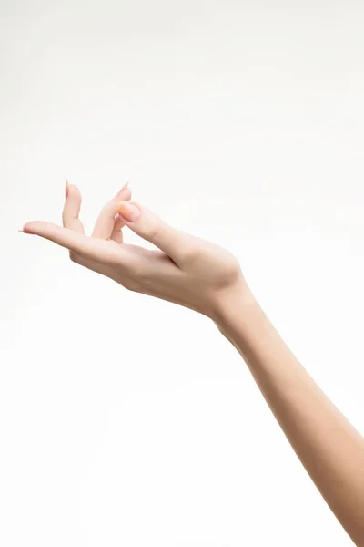 Mooie vrouw de hand met licht roze manicure op de nagels — Stockfoto