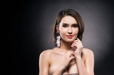 Beautiful mixed asian-caucasian race girl wearing earrings clipart