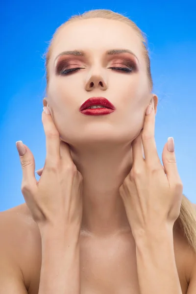 The beautiful blonde red lips girl touches by fingers her face a — Stock Photo, Image