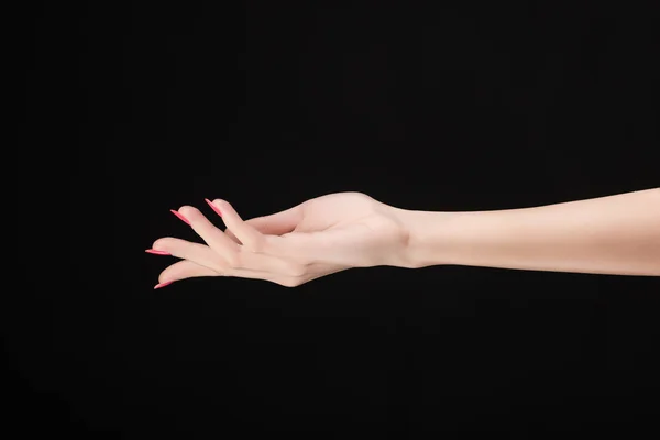 Krásná žena ruku s růžová manikúra nehty izolované na — Stock fotografie
