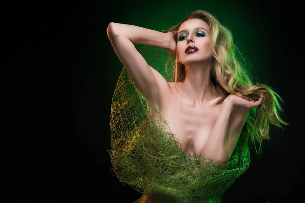 Topless girl blonde wrapped in a green network for bouquets, cov — Stock Photo, Image