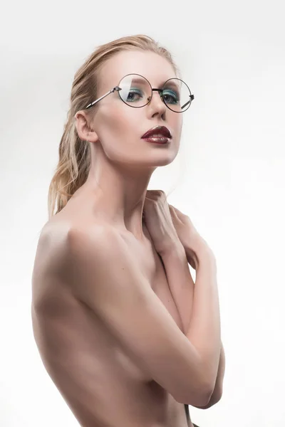 Beautiful naked shoulders young girl wearing round glasses portr — Stock Photo, Image