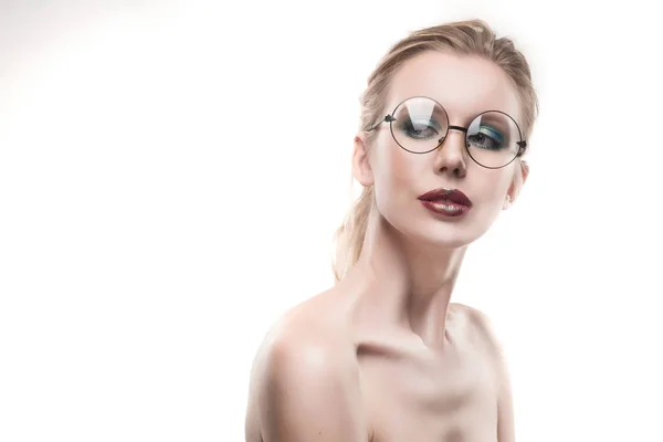 Beautiful naked shoulders young girl wearing round glasses portr — Stock Photo, Image