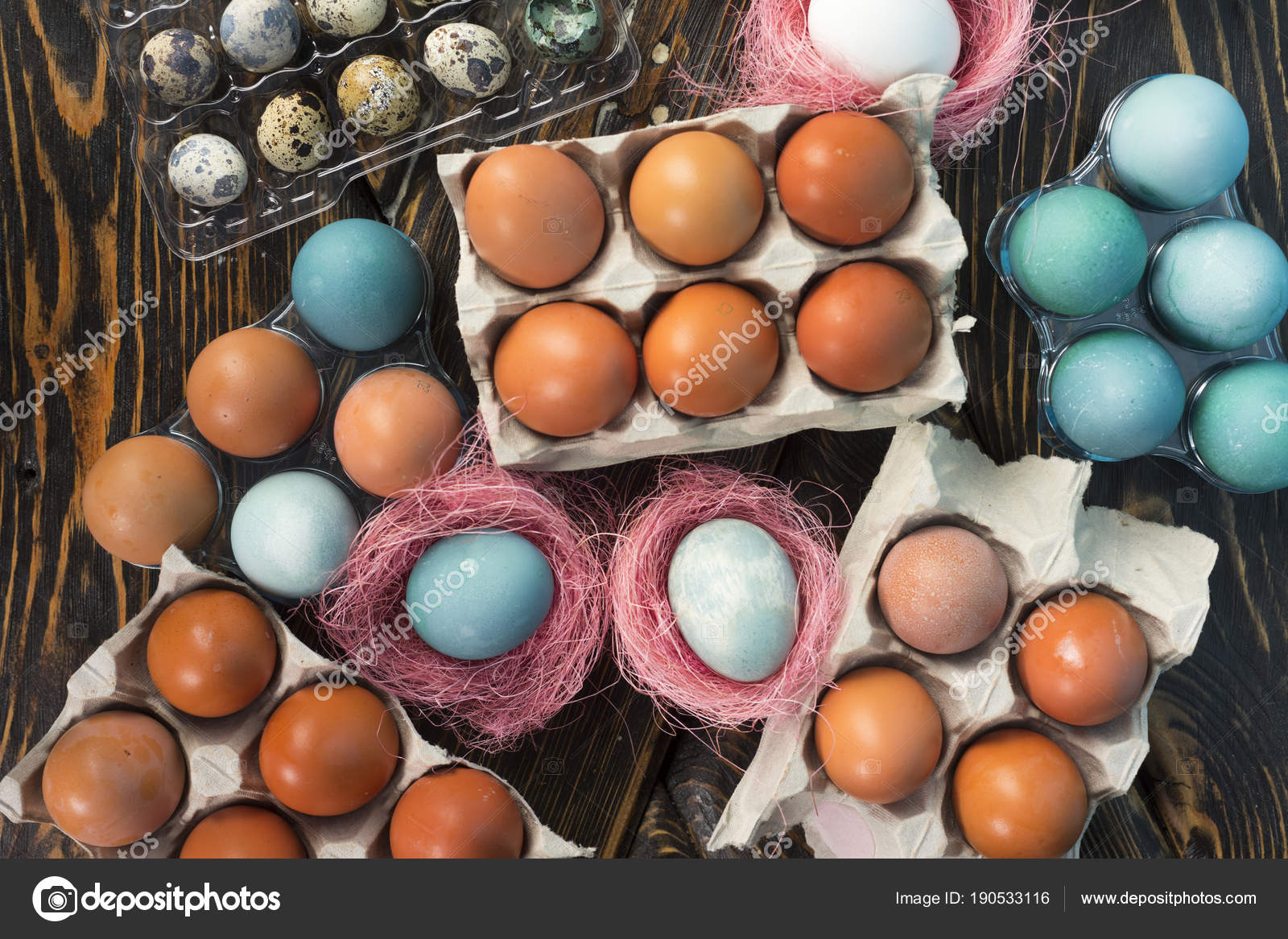 White Blue And Yellow En Eggs In Carton Egg Boxes Qua White Blue And Yellow En Eggs In Carton Egg Boxes Quail Plastic Box Decorated With A Pink Sisal Nests On Vintage Style Wooden Table