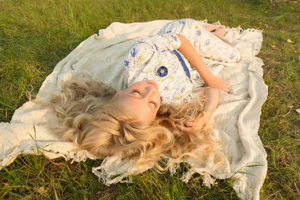 Tired beautiful charming barefoot blonde teenage painter girl we — Stock Photo, Image