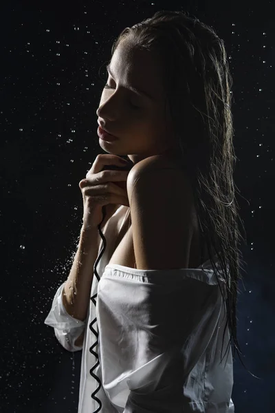 Beautiful wet naked shoulders slim girl wearing white wet shirt