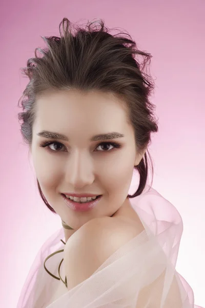 Closeup portrait of a beautiful smiling asian girl wearing pink — Stock Photo, Image