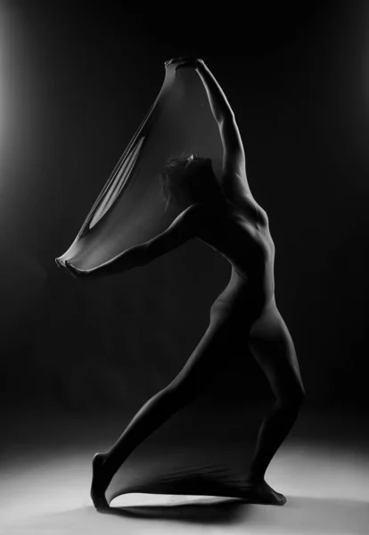 Slim girl wearing a white bodysuit dances a modern avant garde d — 스톡 사진