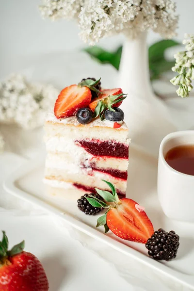 Sliced White Berry Cream Cake Decorated Strawberries Blackberries Lilac Flowers — Stock Photo, Image
