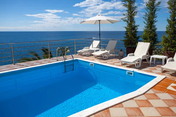Relaxation  solarium nook next to swimming pool — Stock Photo, Image