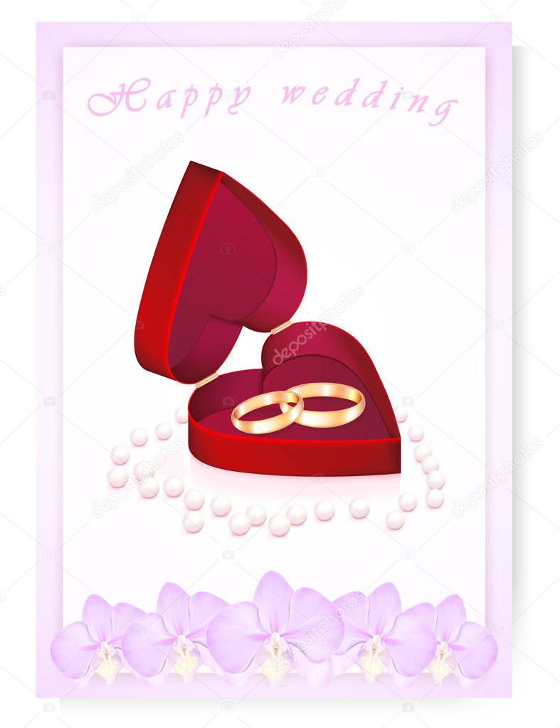 Wedding rings in a heart box with pearls and orchids