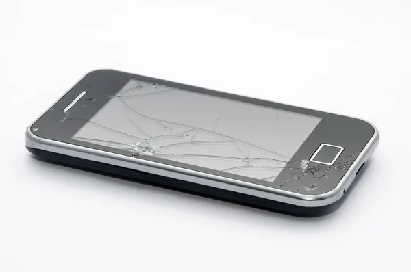 Black smartphone with cracked screen isolated on white backgroun