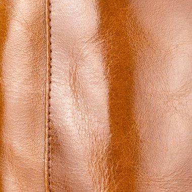 Lüks hafif kahverengi parlak deri vurguları, degradeler ve dikişleri closeup ile