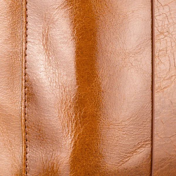 Lüks hafif kahverengi parlak deri vurguları, degradeler ve dikişleri closeup ile