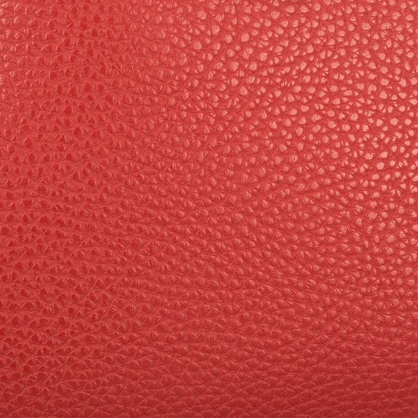 Um pedaço de couro artificial vermelho escuro textura closeup — Fotografia de Stock