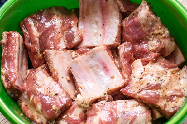 Raw marinated meat on bones with spices — Stock Photo, Image