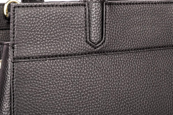Частина чорної шкіряної сумки з ручками і хорошою текстурою — стокове фото