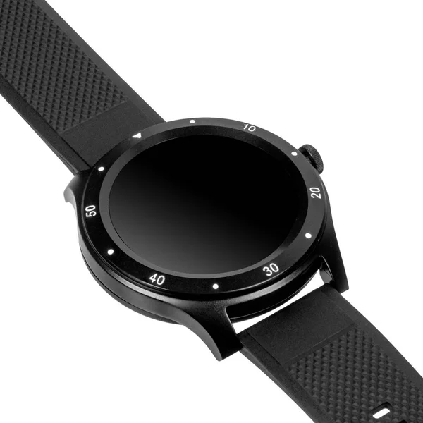 Wireless smartwatch in a round matte black case with numbers on the rim and a silicone strap on a white background. Diagonal view — 스톡 사진