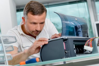 Man repairing printer and man clipart