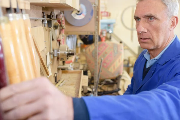 Closeup of a senior carpenter working — Stock Photo, Image