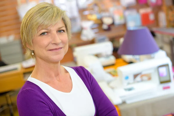 Woman posing in a workshop — Stock Photo, Image