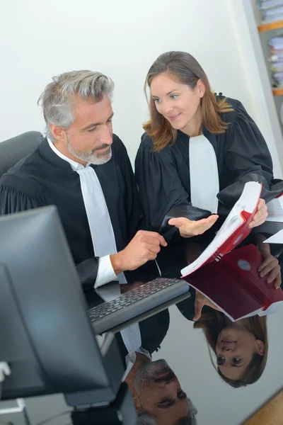 Lawyers talking about the penal code — Stock Photo, Image