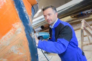 inspecting the boat hull clipart