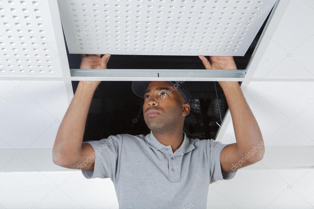 Man Repairing In The Ceiling Stock Photo C Photography33