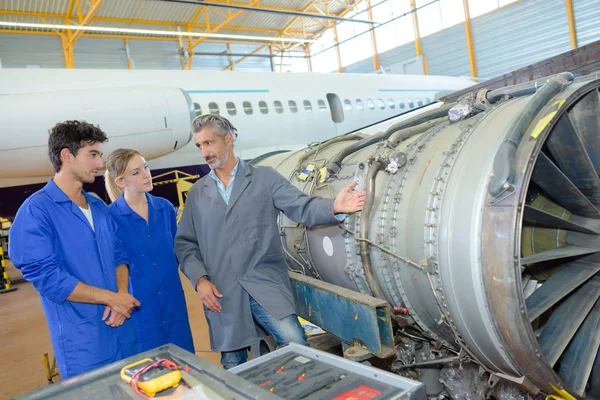 People looking at aircraft engine — Stock Photo, Image