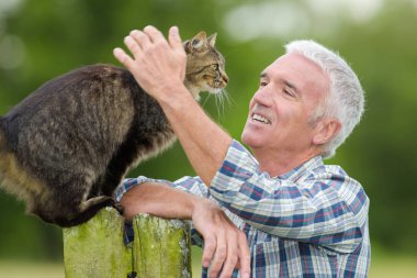 Man caressing cat and caress clipart