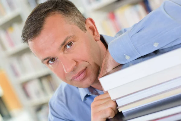 Man with books and copywriter — Stock Photo, Image