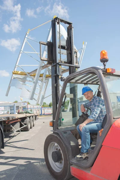 Male driver in forklift truck — Stock Photo, Image